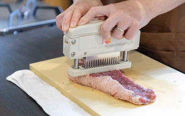 Meat tenderizer on steak