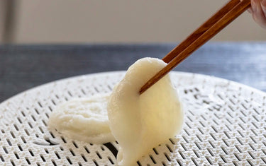 Grilled mochi on grill net