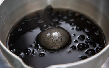 cast iron ball in black beans