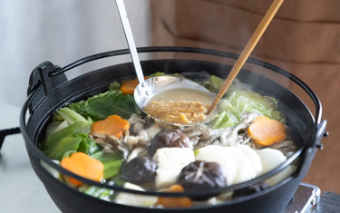 Dissolving miso into nabe hotpot