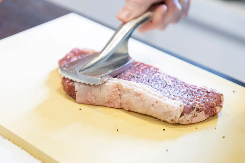 Tenderizing Meat with Blades and Mallets