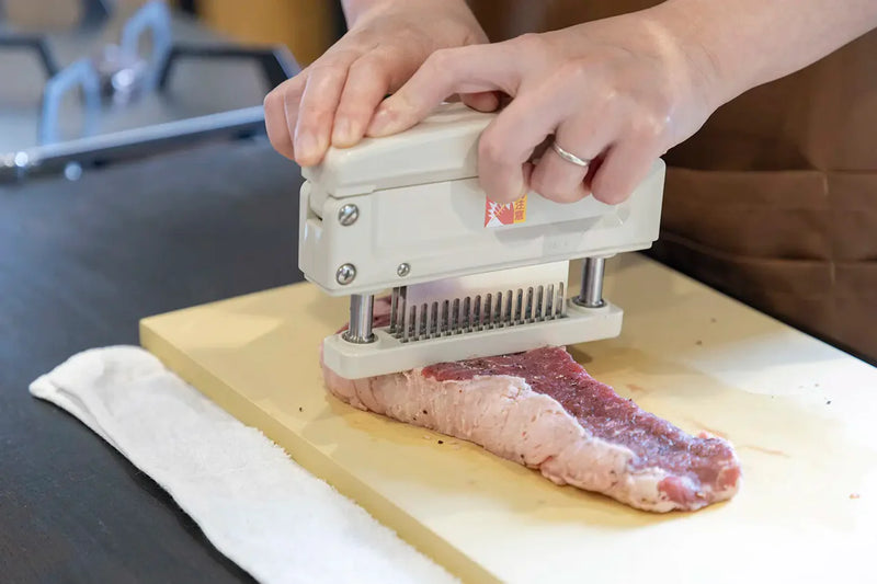 Tenderizing Meat with Blades and Mallets