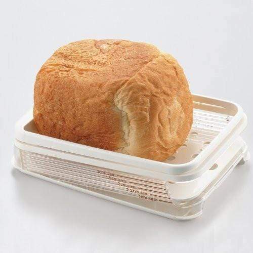 https://www.globalkitchenjapan.com/cdn/shop/products/akebono-freshly-baked-bread-slicer-with-crumb-catcher-bread-slicers-23345053839.jpg?v=1564097683
